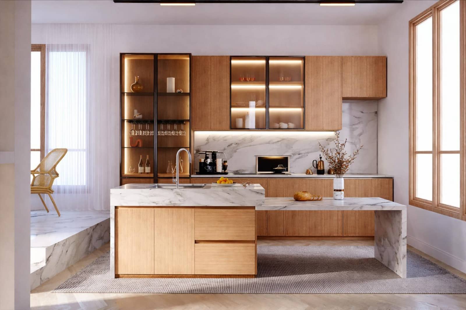 Cuisine haut de gamme avec îlot central en marbre blanc et façades bois clair - Cuisiniste Lyon Caluire